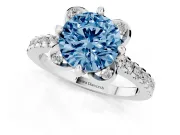 Fancy Blue Round Cut Diamond Solitaire Ring Set in Platinum with Pavé Band and Floral Prong Setting