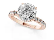 6 Carat Round Cut Pavé Solitaire Ring Set in Rose gold with Round Band Accents and Prong Setting