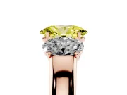 Fancy Yellow Three-Stone Oval Cut Diamond Ring Set in Rose gold with Matching Prong Settings and Plain Band
