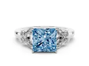 Fancy Blue Princess Cut Diamond Solitaire Floral Ring Set in White gold with Marquise Petals and Prong Setting