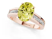 Fancy Yellow Oval Cut Diamond Solitaire Ring Set in Rose gold with Channel-Set Band and Prong Setting