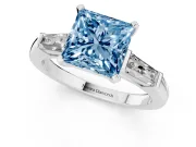 Fancy Blue Princess Cut Diamond Solitaire Ring Set in Platinum with Tapered Baguette Side Stones and Prong Setting