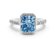 Fancy Blue Radiant Cut Diamond Halo Engagement Ring Set in Silver with Pavé Band and Prong Setting