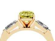 Fancy Yellow Emerald Cut Diamond Solitaire Ring Set in Yellow gold with Tapered Baguette Side Stones and Prong Setting