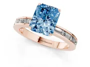 Fancy Blue Radiant Cut Diamond Solitaire Ring Set in Rose gold with Channel-Set Baguette Band and Prong Setting