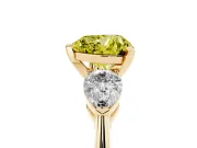 Fancy Yellow Three-Stone Heart Cut Diamond Ring Set in Yellow gold with Pear Side Stones and Prong Setting
