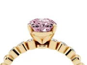 Fancy Pink Oval Cut Diamond Solitaire Engagement Ring Set in Yellow gold with Bezel Accents on Beaded Band