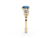 Fancy Blue Heart Cut Diamond Cluster Engagement Ring Set in Yellow gold with Pavé Band and Prong Setting