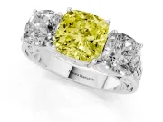 Fancy Yellow Cushion Cut Diamond Three-Stone Ring Set in Platinum with Textured Band