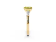 Fancy Yellow Emerald Cut Diamond Solitaire Ring Set in Yellow gold with Tapered Baguette Side Stones and Prong Setting