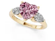 Fancy Pink Three-Stone Heart Cut Diamond Ring Set in Yellow gold with Pear Side Stones and Prong Setting
