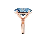 Fancy Blue Oval Cut Diamond Solitaire Engagement Ring Set in Rose gold with Thin Band and Prong Setting