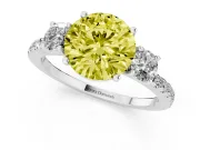 Fancy Yellow Round Cut Diamond Three-Stone Ring Set in White gold with Pavé Band and Graduated Sides