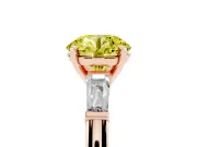 Fancy Yellow Round Cut Diamond Solitaire Ring Set in Rose gold with Tapered Baguette Side Stones and Prong Setting
