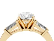 Pear Cut Diamond Solitaire Ring Set in Yellow gold with Tapered Baguette Accents and Prong Setting