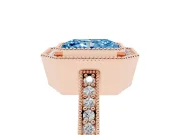 Fancy Blue Radiant Cut Diamond Halo Engagement Ring Set in Rose gold with Pavé Band and Round Halo Stones