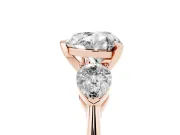 Three-Stone Heart Cut Diamond Ring Set in Rose gold with Pear Side Stones and Prong Setting