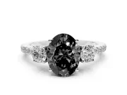 Fancy Black Oval Cut Diamond Three-Stone Ring Set in White gold with Pavé Band and Graduated Sides