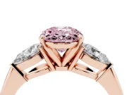 Fancy Pink Three-Stone Oval Cut Diamond Ring Set in Rose gold with Pear Side Stones and Prong Setting