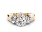 Three-Stone Pear Cut Diamond Ring Set in Yellow gold with Matching Prong Settings and Plain Band