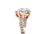 Heart Cut Diamond Solitaire Engagement Ring Set in Rose gold with Twisted Pavé Band and Prong Setting