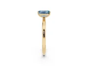 Fancy Blue Emerald Cut Diamond Solitaire Ring Set in Yellow gold with Prong Setting on a Polished Plain Band
