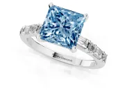 Fancy Blue Princess Cut Diamond Solitaire Set in White gold with Side Baguettes and Channel Set Band