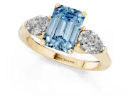 Fancy Blue Three-Stone Emerald Cut Diamond Ring Set in Yellow gold with Pear Side Stones and Prong Setting