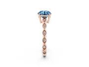 Fancy Blue Round Cut Diamond Solitaire Ring Set in Rose gold with Infinity Twist Pavé Band