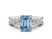 Fancy Blue Emerald Cut Diamond Three-Stone Ring Set in White gold with Pavé Split Shank and Prong Setting