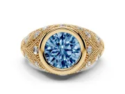 Fancy Blue Round Cut Diamond Bezel Ring Set in Yellow gold with Milgrain Accent Band