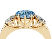 Fancy Blue Heart Cut Diamond Three-Stone Ring Set in Yellow gold with Bold Center and Classic Band