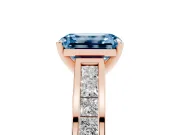 Fancy Blue Emerald Cut Diamond Solitaire Ring Set in Rose gold with Channel-Set Band and Prong Setting