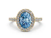 Fancy Blue Oval Cut Diamond Halo Pavé Solitaire Ring Set in Yellow gold with Prong-Set Center Stone