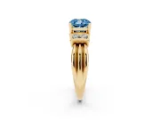 Fancy Blue Three-Stone Cushion Cut Diamond Channel Set Ring Set in Yellow gold with Bar Prongs