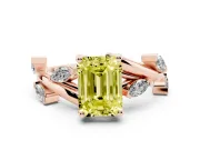 Fancy Yellow Emerald Cut Diamond Solitaire Ring Set in Rose gold with Twisted Marquise Accent Band