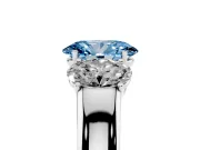 Fancy Blue Three-Stone Oval Cut Diamond Ring Set in Platinum with Matching Prong Settings and Plain Band
