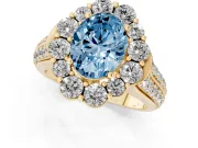 Fancy Blue Oval Cut Diamond Halo Engagement Ring Set in Yellow gold with Split Shank and Prong Setting