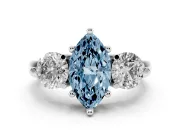 Fancy Blue Marquise Cut Diamond Three-Stone Ring Set in Platinum with Prong Setting and Classic Band