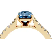 Fancy Blue Emerald Cut Diamond Solitaire Engagement Ring Set in Yellow gold with Delicate Pavé Band and Prong Setting