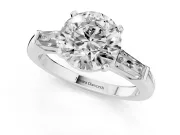 Round Cut Diamond Solitaire Ring Set in Silver with Tapered Baguette Side Stones and Prong Setting