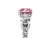 Fancy Pink Three-Stone Cushion Cut Diamond Pavé Band Ring Set in White gold with Prong-Set Trio