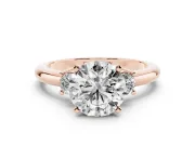 Three-Stone Round Cut Diamond Ring Set in Rose gold with Prong Setting and Plain Band
