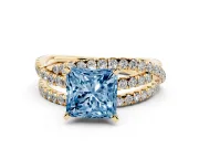 Fancy Blue Princess Cut Diamond Solitaire Twist Band Ring Set in Yellow gold with Pavé Setting and Prong Head