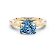 Fancy Blue Heart Cut Diamond Solitaire Ring Set in Yellow gold with Prong Setting and Classic Band