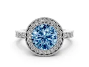 Fancy Blue Round Cut Diamond Halo Engagement Ring Set in Silver with Pavé Band and Round Halo Stones