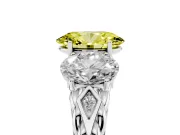 Fancy Yellow Oval Cut Diamond Three-Stone Ring Set in Platinum with Braided Band