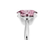 Fancy Pink Oval Cut Diamond Solitaire Ring Set in Silver with Prong Setting on a Plain Round Band