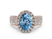 Fancy Blue Oval Cut Diamond Halo Ring Set in Rose gold with Pavé Band and Raised Center Setting