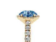 Fancy Blue Round Cut Diamond Halo Engagement Ring Set in Yellow gold with Pavé Band and Prong Setting